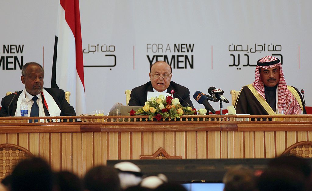 Yemen's President Abed Rabbo Mansour Hadi (C) speaks during the closing ceremony of a national dialogue conference aimed at drafting a new constitution and establishing a federal state on January 25, 2014 in Sanaa.