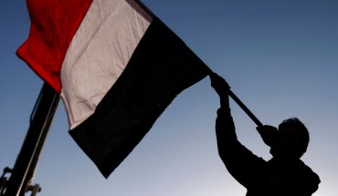 A Yemeni waves a national flag during a rally celebrating the death of Yemeni ex-president Ali Abdullah Saleh a day after he was killed, in the capital Sanaa on December 5, 2017. 